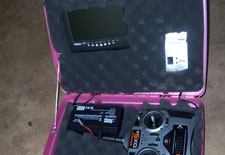 Base station with extra LCD screen, video goggles, video receiver, RC remote, and 12v battery for power