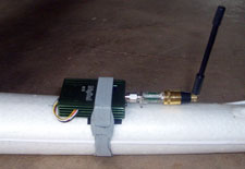 Transmitter mounted on tail section for weight distribution