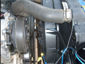 Looking from the driver side, their is plenty of clearance between the fan and engine