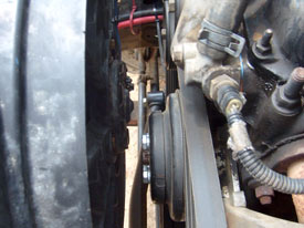 Looking from the passenger side, their is plenty of clearance between the fan and engine