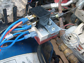 My original setup. The mounted thermostatic controller and relay. Notice the right side of the relay has started to melt