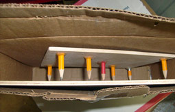 The stylus and bottom board inserted into box